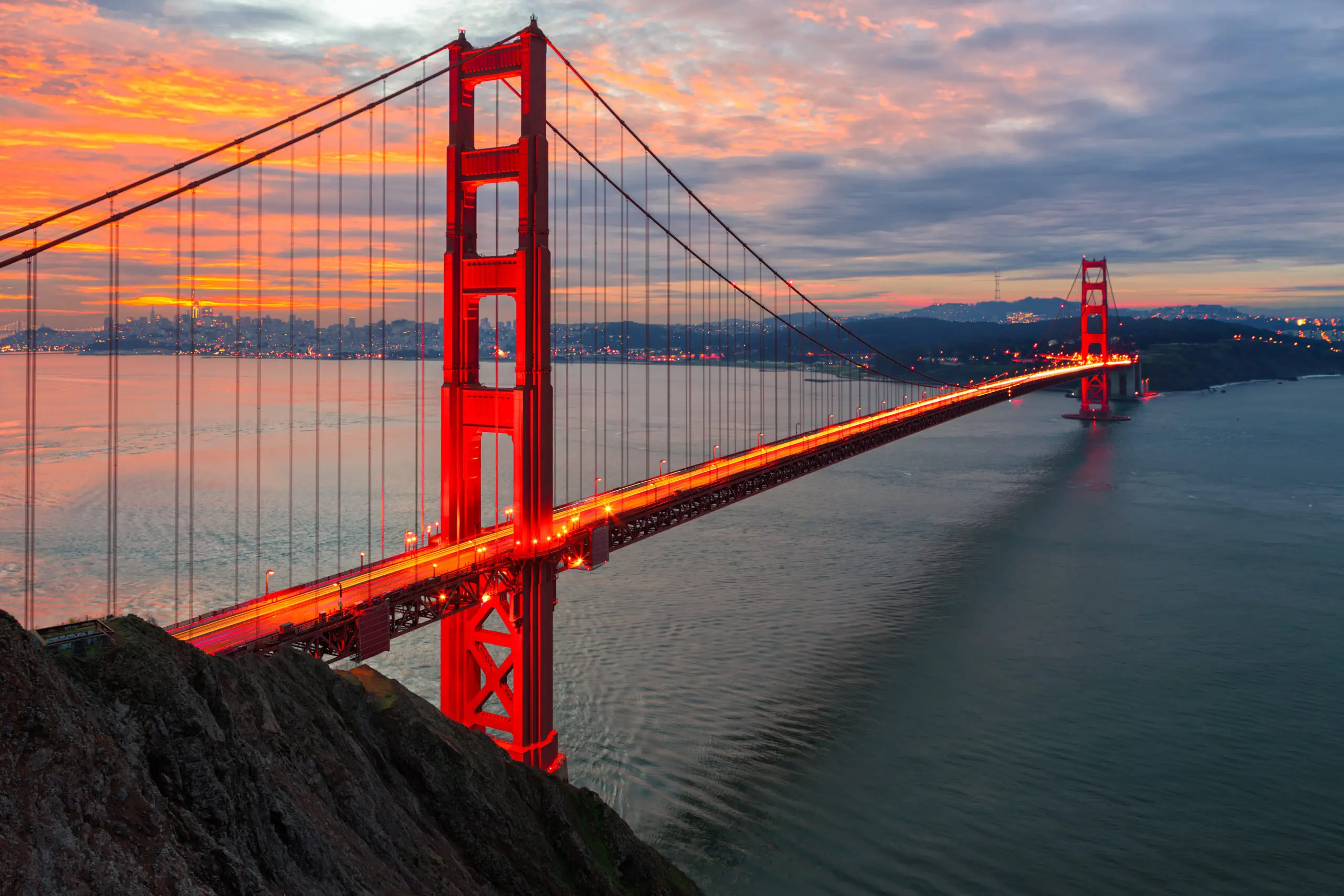 The sun rises over San Francisco and the Golden Gate Bridge
